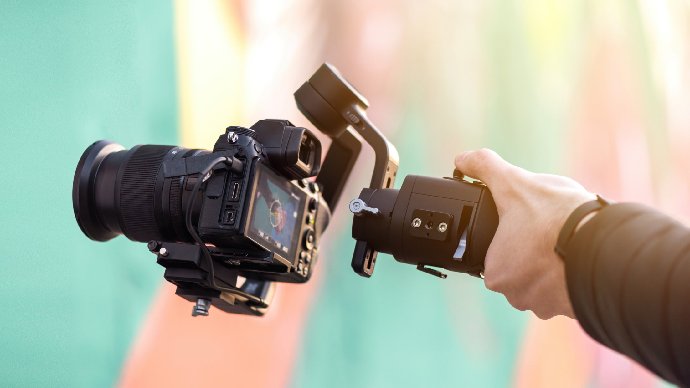 Photographer Holding a Camera with Stabilizer